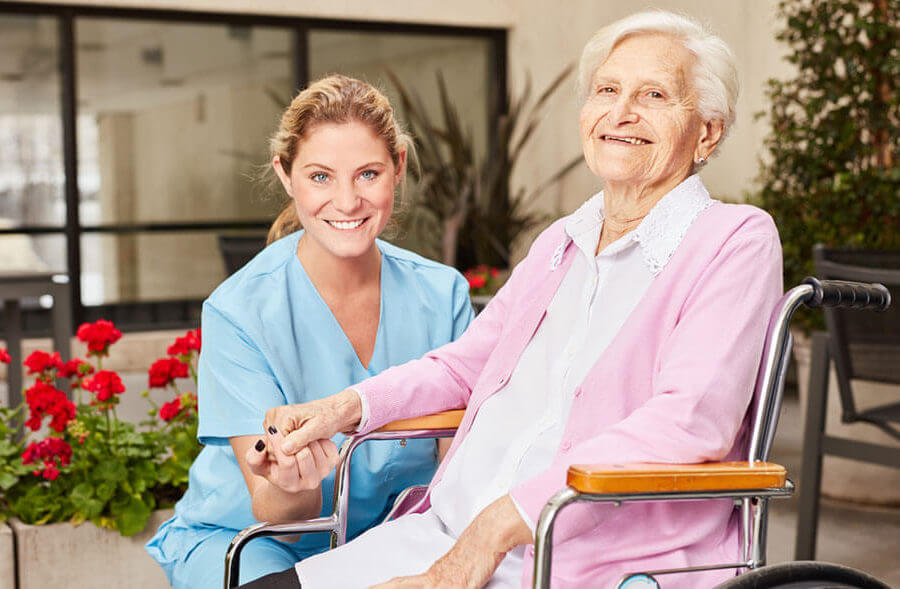 Senior woman with home care health aide.