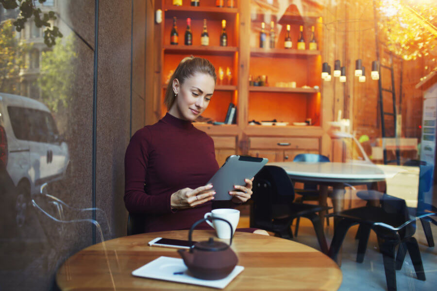 Restaurant owner working on accounting on their iPad