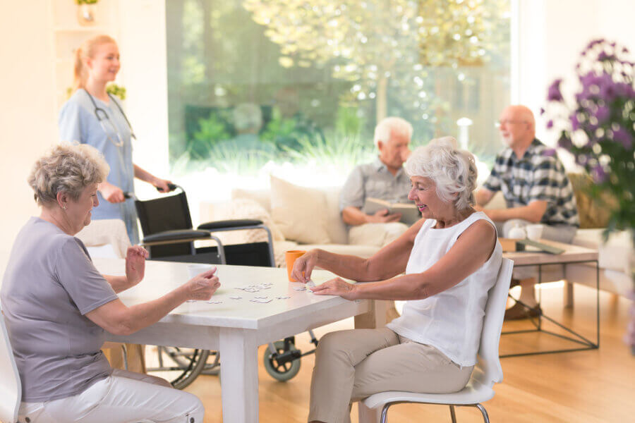 Seniors play games together for adult day services