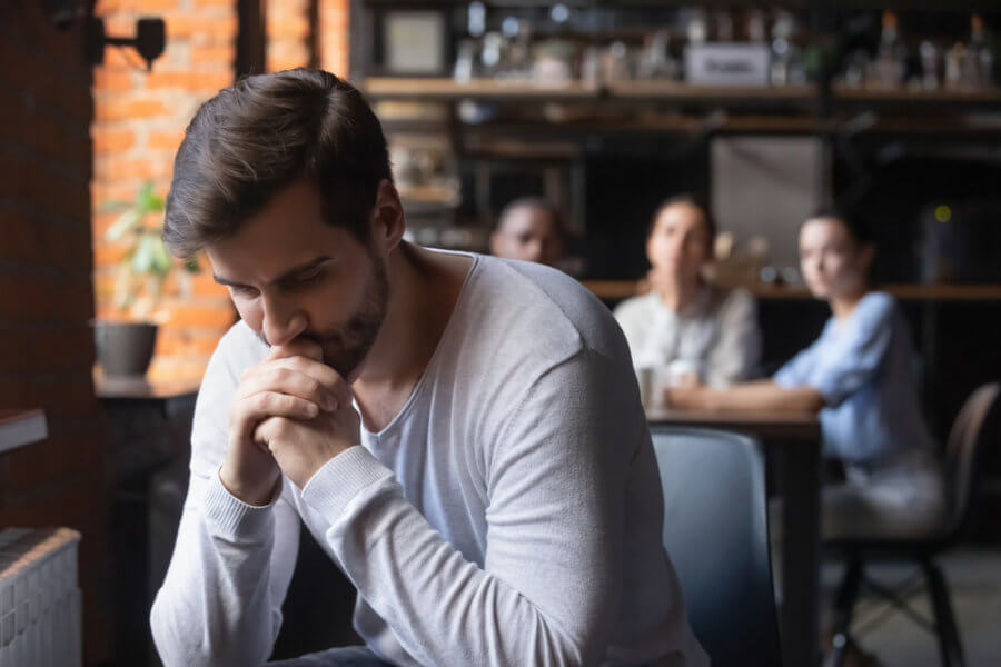 Man feeling disconnected at restaurant