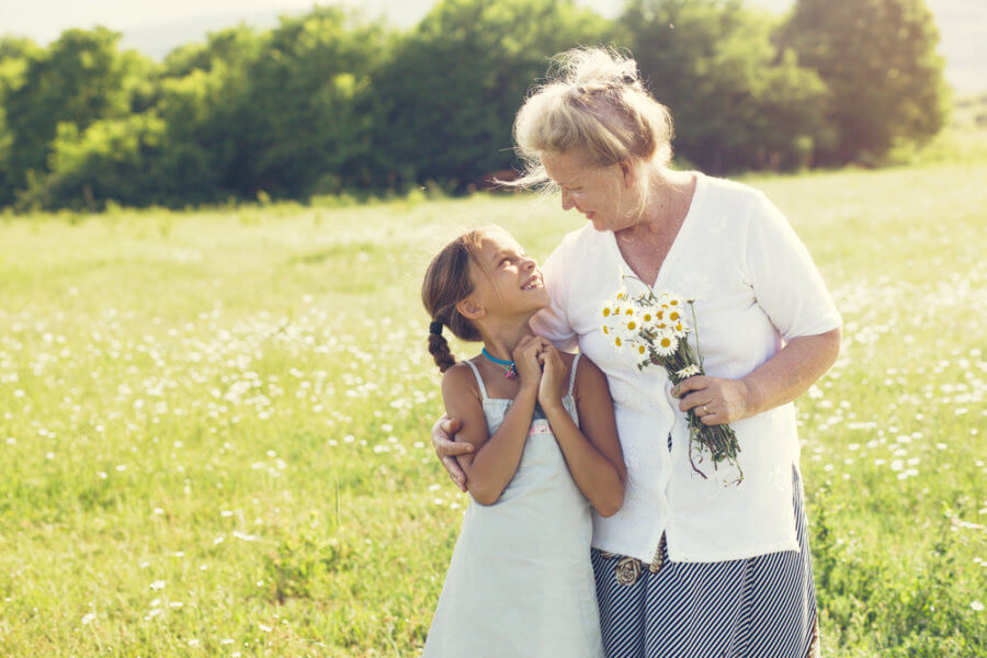 Woman with grandaughter happy after her functional medicine treatment for menopause