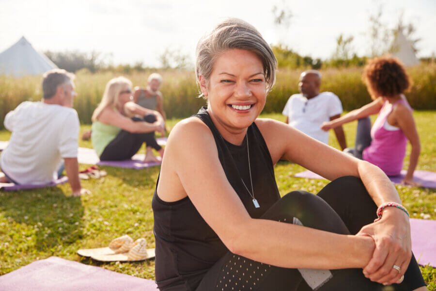 Woman at outdoor event, feeling better after treatment for Hashimoto's Disease