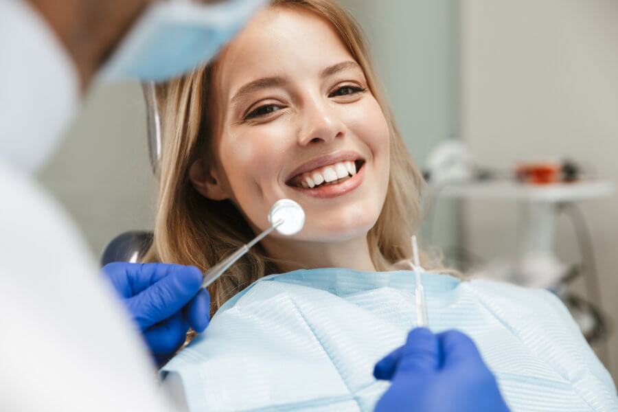 Woman smiling at her holistic dentist