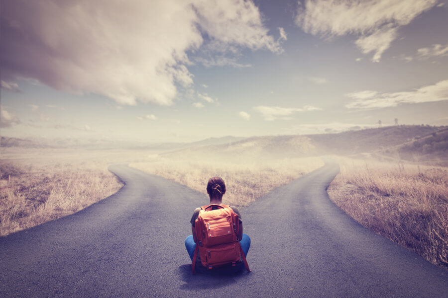 Woman contemplating on a major decision at a crossroad