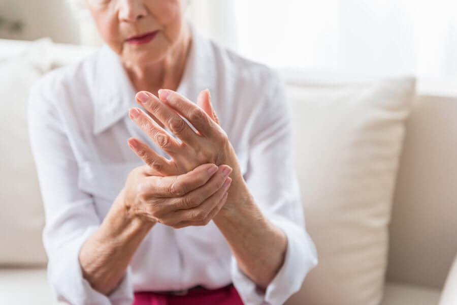 Older woman with inflammatory arthritis