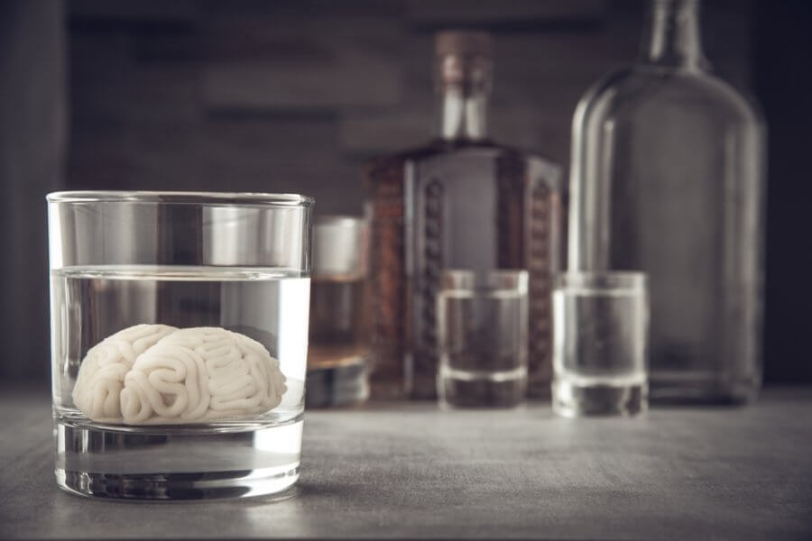 Brain in a cup being affected by addiction to give it disease