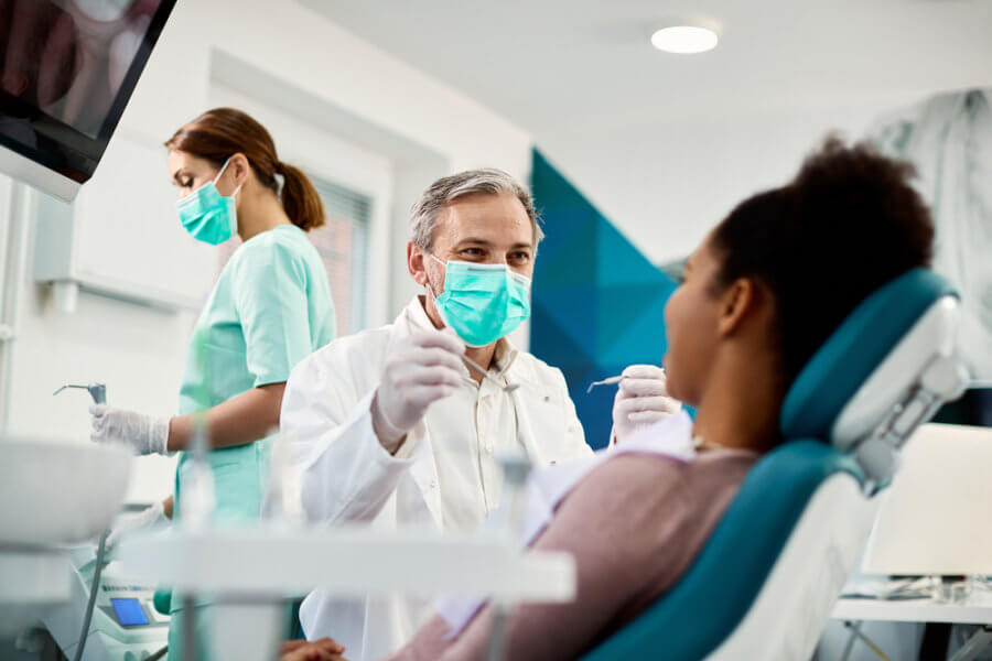 Woman at dental appointment for removing silver fillings