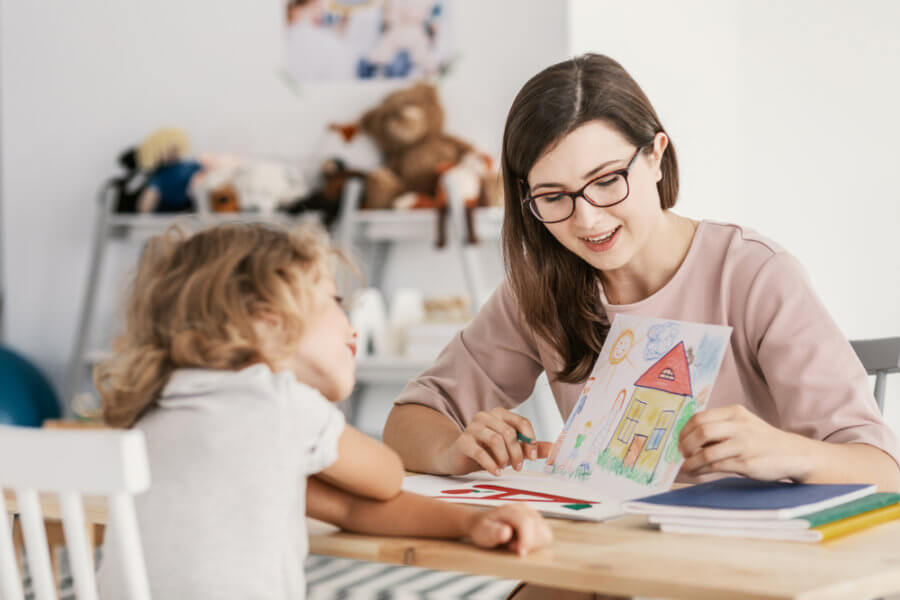 Mental Health professional works with child patient.