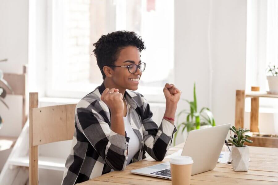 Woman excitedly reviews her Mental Health Clinic Website Design