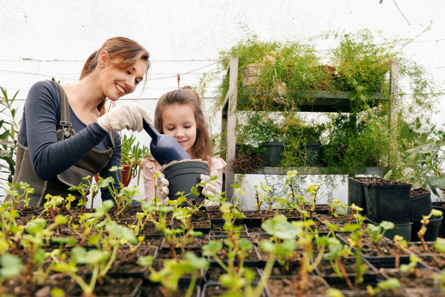 Mother and daughter gardening together after mother beats her stress and immune system