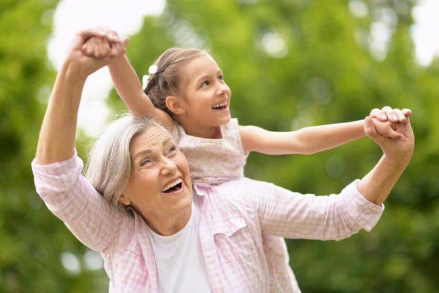 Happy senior plays with her granddaughter, feeling better with help from thyroid issues.