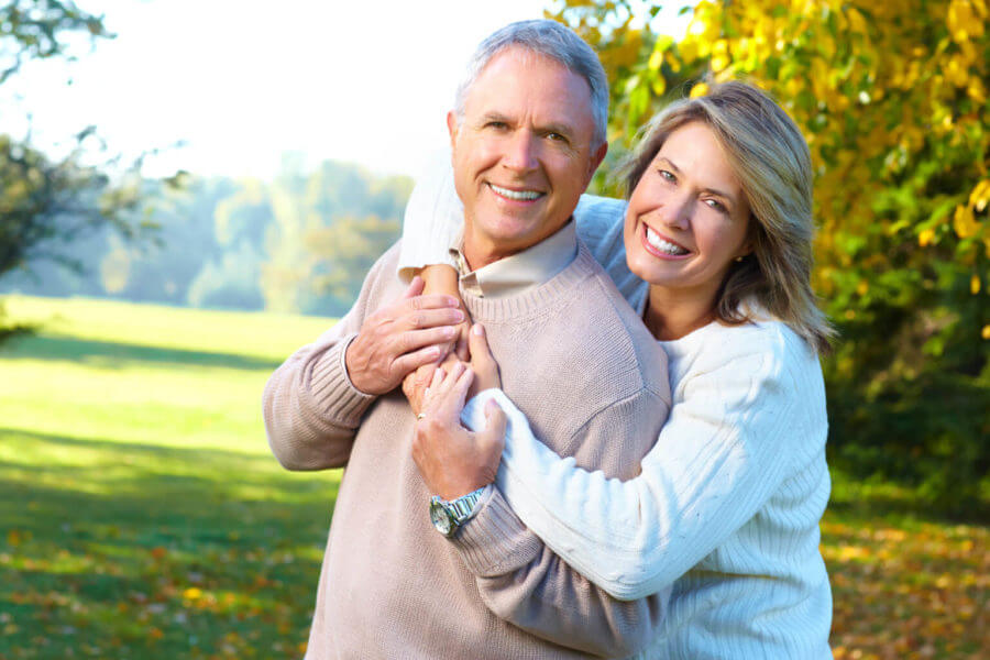 Older couple enjoy the park after recovering from thyroid problems.