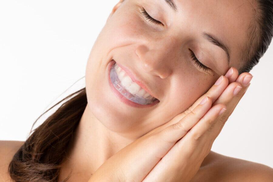 Woman sleeping with mouth guard